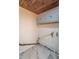 A basement showcases a wooden ceiling and marble floor with various pipes and utility lines, adding character at 2539 S Lyons Ave, Indianapolis, IN 46241