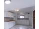 Modern kitchen with marble tile flooring, white cabinets, butcher block counters, and gray subway tile backsplash at 2539 S Lyons Ave, Indianapolis, IN 46241
