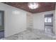 Bright room with wood ceiling, marble floor, and stylish light fixture creates a unique and inviting space at 2539 S Lyons Ave, Indianapolis, IN 46241