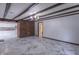 Elegant living room with beamed ceilings, marble floors, a brick accent wall, and open access to the kitchen at 2539 S Lyons Ave, Indianapolis, IN 46241