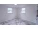 Well-lit room features white walls, marble-style tiled floors and two windows at 2539 S Lyons Ave, Indianapolis, IN 46241