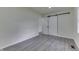 Bedroom featuring a large closet with double doors and new flooring at 2706 Shakespeare Dr, Indianapolis, IN 46227