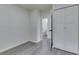 Bright bedroom with vinyl flooring, large closet, and adjoining bathroom at 2706 Shakespeare Dr, Indianapolis, IN 46227