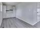 Additional room offers gray flooring, crisp white paint, storage, and a bright window at 2706 Shakespeare Dr, Indianapolis, IN 46227