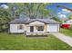 Charming, renovated single-story home boasts a freshly painted exterior and well-manicured lawn at 2706 Shakespeare Dr, Indianapolis, IN 46227