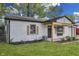 A charming, freshly painted home with new shutters and a cozy front porch and attached garage at 2706 Shakespeare Dr, Indianapolis, IN 46227