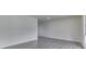 Modern interior showcasing new gray flooring, fresh paint, and ample natural light at 2706 Shakespeare Dr, Indianapolis, IN 46227