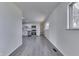Inviting, open-concept living space featuring gray floors, updated stainless steel appliances and eat in kitchen at 2706 Shakespeare Dr, Indianapolis, IN 46227