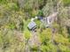 Aerial view of a secluded home nestled among lush trees at 2985 Little Hurricane Rd, Martinsville, IN 46151