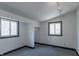 Bedroom featuring two large windows for natural light and neutral-toned carpet flooring at 2985 Little Hurricane Rd, Martinsville, IN 46151