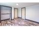 Bedroom features a closet, modern trim, and luxury vinyl plank flooring at 2985 Little Hurricane Rd, Martinsville, IN 46151