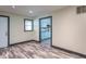 Bright dining area with wood floors, neutral paint, and an open doorway to the kitchen at 2985 Little Hurricane Rd, Martinsville, IN 46151