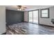 Living room featuring slider door to deck, modern colors and luxury vinyl plank flooring at 2985 Little Hurricane Rd, Martinsville, IN 46151