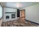 Bright living room with wood floors, a fireplace, and modern trim at 2985 Little Hurricane Rd, Martinsville, IN 46151