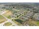 An aerial perspective of a well-planned residential community with ponds at 3006 Wildcat Ln, Indianapolis, IN 46203