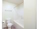 Clean bathroom with a toilet, tub-shower and tile flooring at 3006 Wildcat Ln, Indianapolis, IN 46203
