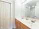 Bright bathroom featuring a double sink vanity, large mirror and neutral decor at 3006 Wildcat Ln, Indianapolis, IN 46203