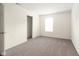 Bright, carpeted bedroom with a closet, window and fresh white walls at 3006 Wildcat Ln, Indianapolis, IN 46203