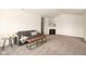 Bright living room featuring neutral walls, new carpet, and stylish modern furniture at 3006 Wildcat Ln, Indianapolis, IN 46203