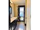 Bathroom featuring a vanity, mirror, tile flooring, and a window with patterned curtains at 301 N Main St, Franklin, IN 46131