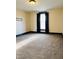 Bedroom featuring carpet flooring, a large window with dark curtains, and baseboard trim at 301 N Main St, Franklin, IN 46131