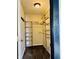 Walk-in closet featuring wire shelving, a light fixture, and carpet flooring at 301 N Main St, Franklin, IN 46131