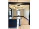 View from kitchen showcases the dining room's hardwood floors and elegant lighting fixture at 301 N Main St, Franklin, IN 46131