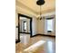Dining area showcases hardwood floors, elegant trim, and large windows with natural light at 301 N Main St, Franklin, IN 46131