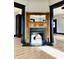 Ornate fireplace framed by wooden accents and flanked by entryways into other living spaces at 301 N Main St, Franklin, IN 46131