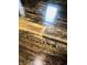 Close-up of the hardwood flooring with an aged look due to darker streaks and knots at 301 N Main St, Franklin, IN 46131