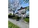 Charming two-story home with a covered front porch, manicured lawn, and mature shade tree at 301 N Main St, Franklin, IN 46131