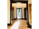 Hallway with hardwood floors and decorative elements, leading to other parts of the home at 301 N Main St, Franklin, IN 46131