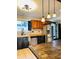 Bright kitchen featuring stainless steel appliances and an adjacent rustic-style dining table at 301 N Main St, Franklin, IN 46131