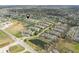 Aerial view of a residential neighborhood surrounded by green trees and scenic ponds at , Indianapolis, IN 46203