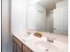 Bathroom featuring a double sink vanity, large mirror, and white door leading to the shower/toilet area at , Indianapolis, IN 46203