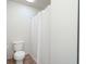 Bathroom featuring a toilet, tile floor, and shower/bath combination with a white shower curtain at , Indianapolis, IN 46203