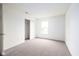 Bedroom with light walls, neutral carpet, closet, and a window with lots of natural light at , Indianapolis, IN 46203