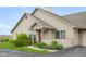 Charming home featuring a welcoming front porch, neat landscaping, and a bright red front door at , Indianapolis, IN 46203