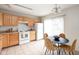Well-lit kitchen with light wood cabinetry, practical appliances, and an adjacent dining space at , Indianapolis, IN 46203