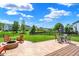 A backyard with a stamped concrete patio, fire pit and chairs for outdoor enjoyment at 3101 Woodhaven Way, Bargersville, IN 46106