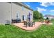 Outdoor space with patio, seating, grill, and fire pit in a fenced yard at 3101 Woodhaven Way, Bargersville, IN 46106