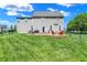 Fenced backyard featuring a patio, fire pit with Adirondack chairs, and a lush lawn at 3101 Woodhaven Way, Bargersville, IN 46106