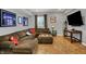 Finished basement with brown sectional and home decor, offering an inviting space for relaxation at 3101 Woodhaven Way, Bargersville, IN 46106