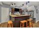 Basement wet bar with wooden counter, seating, offering a perfect spot for entertaining guests at 3101 Woodhaven Way, Bargersville, IN 46106
