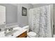 A well-lit bathroom features a sink, toilet, and shower at 3101 Woodhaven Way, Bargersville, IN 46106