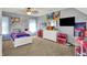 A well-lit bedroom with cartoon decor and plenty of floor space at 3101 Woodhaven Way, Bargersville, IN 46106