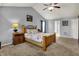 Comfortable bedroom features a ceiling fan, carpet floors, and a large bed at 3101 Woodhaven Way, Bargersville, IN 46106