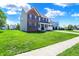 Beautiful two-story brick home with a covered porch, set back on a lush green lawn at 3101 Woodhaven Way, Bargersville, IN 46106