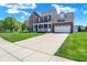 Charming two-story brick home with a spacious driveway and well-manicured lawn at 3101 Woodhaven Way, Bargersville, IN 46106