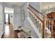 Welcoming foyer with hardwood floors, staircase, and natural light showcasing its charm at 3101 Woodhaven Way, Bargersville, IN 46106